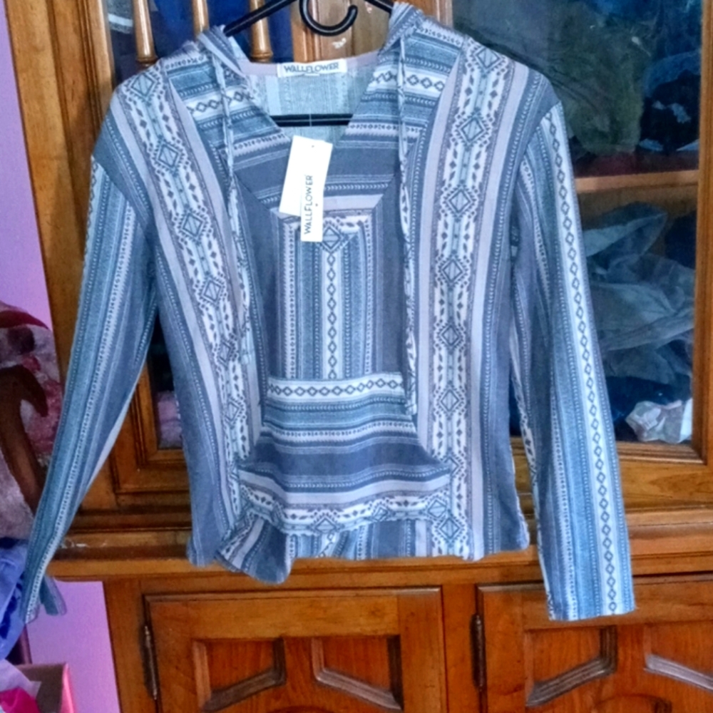 A hoodie shirt with purple,blue and grey designs